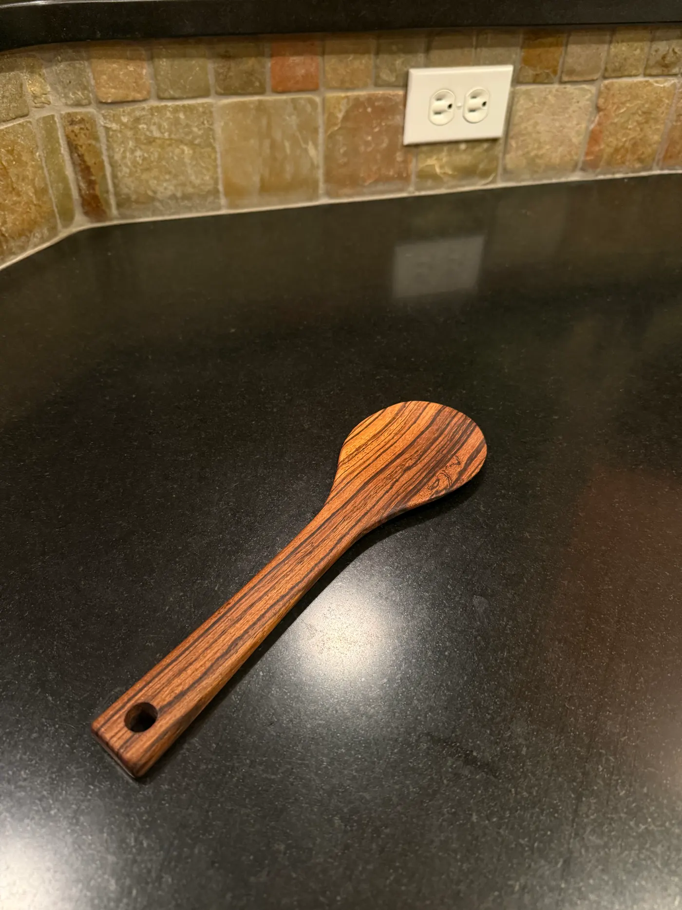 Hand-carved wooden serving spoon